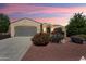 Charming single-story home with beautiful desert landscaping and a well-manicured lawn at 12738 W Nogales Dr, Sun City West, AZ 85375
