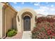 Inviting gated front entry featuring desert landscaping and an arched entryway at 12738 W Nogales Dr, Sun City West, AZ 85375