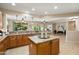 Open kitchen featuring granite counters, island, and stainless steel appliances at 12738 W Nogales Dr, Sun City West, AZ 85375