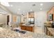 Bright kitchen boasts granite countertops, stainless steel sink, and ample cabinet space at 12738 W Nogales Dr, Sun City West, AZ 85375