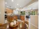 Open-concept kitchen and dining area, stainless appliances, and cozy breakfast nook at 12738 W Nogales Dr, Sun City West, AZ 85375