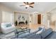 Spacious living area with tile floors, comfortable seating, and open layout at 12738 W Nogales Dr, Sun City West, AZ 85375