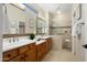 Luxurious main bathroom features a double sink vanity and walk-in shower at 12738 W Nogales Dr, Sun City West, AZ 85375