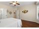 Spacious bedroom featuring hardwood floors, ample closet space, and natural light at 12738 W Nogales Dr, Sun City West, AZ 85375