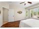Main bedroom features hardwood floors, closet, and views of the outdoors at 12738 W Nogales Dr, Sun City West, AZ 85375
