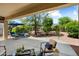 Relaxing covered patio with comfortable seating, perfect for outdoor entertaining and enjoyment at 12738 W Nogales Dr, Sun City West, AZ 85375