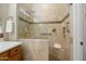 Beautifully tiled walk-in shower with glass enclosure and built-in bench at 12738 W Nogales Dr, Sun City West, AZ 85375