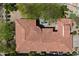 Aerial view of home with distinctive red tile roof, multiple patios, and lush desert landscaping at 14037 E Coyote Rd, Scottsdale, AZ 85259