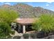 Private backyard featuring covered patio and desert landscape with mountain backdrop provides serene outdoor living at 14037 E Coyote Rd, Scottsdale, AZ 85259