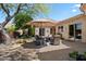 Outdoor seating area on a paver patio with decorative lighting, desert landscaping, and mountain views at 14037 E Coyote Rd, Scottsdale, AZ 85259