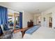 Bedroom with hardwood floors and a sliding door that leads to a covered patio with seating at 14037 E Coyote Rd, Scottsdale, AZ 85259