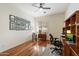 Office features hardwood floors, a ceiling fan, natural light, and built in desk at 14037 E Coyote Rd, Scottsdale, AZ 85259