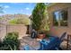 Private patio area with charming brick accents and relaxing Adirondack chairs with mountain views at 14037 E Coyote Rd, Scottsdale, AZ 85259
