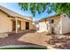 Backyard featuring a patio, artificial turf, desert landscaping, privacy fence, and storage shed at 14815 N 21St St, Phoenix, AZ 85022