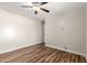 Bedroom with ceiling fan, wood floors, and neutral paint at 14815 N 21St St, Phoenix, AZ 85022