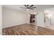 A bedroom offers neutral walls and flooring adjacent to a large closet and storage area at 14815 N 21St St, Phoenix, AZ 85022