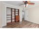 This bedroom includes a closet, ceiling fan, and wood floors at 14815 N 21St St, Phoenix, AZ 85022