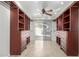 A large closet featuring built-in shelving and drawers opens to an exterior patio at 14815 N 21St St, Phoenix, AZ 85022