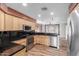 Well-equipped kitchen with stainless steel appliances, granite countertops, and ample cabinet space at 14815 N 21St St, Phoenix, AZ 85022