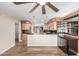 An open-concept kitchen features light wood cabinets, a dark countertop, and stainless steel appliances at 14815 N 21St St, Phoenix, AZ 85022