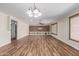 Spacious living room featuring laminate floors and natural light at 14815 N 21St St, Phoenix, AZ 85022
