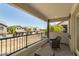 A spacious balcony with a black metal railing offering views of surrounding homes and greenery at 1635 N 208Th Ave, Buckeye, AZ 85396