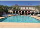Resort-style pool area with palm trees, lounge chairs, and a splash pad, perfect for Gathering fun at 1635 N 208Th Ave, Buckeye, AZ 85396