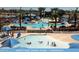 Gathering-friendly community pool with ample seating, shade umbrellas, and shallow areas for  at 1635 N 208Th Ave, Buckeye, AZ 85396
