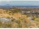 Desert landscape view featuring modern homes and distant mountain views at 1635 N 208Th Ave, Buckeye, AZ 85396