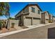 Two-story home featuring an attached two-car garage and desert landscaping at 1635 N 208Th Ave, Buckeye, AZ 85396