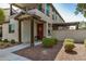 Inviting front exterior with a cozy porch, a decorative wreath, and drought-resistant landscaping at 1635 N 208Th Ave, Buckeye, AZ 85396