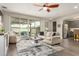 Inviting living room featuring a sliding glass door that opens onto a charming patio at 1635 N 208Th Ave, Buckeye, AZ 85396