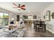 Open floor plan showcasing the living room, dining area, and kitchen with a view of the kitchen island at 1635 N 208Th Ave, Buckeye, AZ 85396