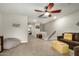 Comfortable living room with ceiling fan, neutral walls, and plush carpet at 1635 N 208Th Ave, Buckeye, AZ 85396