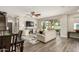 Living room view with contemporary furniture, TV, and access to the outdoor patio at 1635 N 208Th Ave, Buckeye, AZ 85396