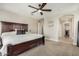 Spacious main bedroom with archway to ensuite bathroom and large bed and ceiling fan at 1635 N 208Th Ave, Buckeye, AZ 85396