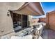 Comfortable back patio with awning that opens to a well-maintained backyard at 17606 N 17Th Pl # 1054, Phoenix, AZ 85022
