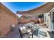 Inviting backyard with shaded patio, comfortable seating, and colorful landscaping at 17606 N 17Th Pl # 1054, Phoenix, AZ 85022