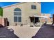 Large backyard with patio area, privacy walls, and mature trees providing shade and seclusion at 17606 N 17Th Pl # 1054, Phoenix, AZ 85022