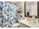 Bathroom featuring a single sink vanity, floral shower curtain, and chrome fixtures at 17606 N 17Th Pl # 1054, Phoenix, AZ 85022