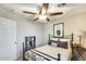 Bedroom with ceiling fan, featuring a large window and neutral walls with soft lighting at 17606 N 17Th Pl # 1054, Phoenix, AZ 85022
