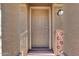 Inviting front door with sidelights and a decorative 'Welcome' sign at 17606 N 17Th Pl # 1054, Phoenix, AZ 85022