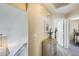 Upstairs hallway featuring neutral color scheme, carpeted floor, and view of bedroom and linen closet at 17606 N 17Th Pl # 1054, Phoenix, AZ 85022