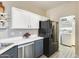 Well-lit kitchen featuring stainless steel appliances, modern cabinetry, and a neutral color scheme at 17606 N 17Th Pl # 1054, Phoenix, AZ 85022