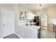 Bright kitchen boasts white upper cabinets, gray lower cabinets, and stainless steel appliances at 17606 N 17Th Pl # 1054, Phoenix, AZ 85022