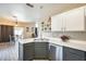 Bright kitchen featuring modern appliances, white cabinets, and an open layout perfect for entertaining at 17606 N 17Th Pl # 1054, Phoenix, AZ 85022