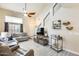 Comfortable living room features high ceilings, tile floors, and cozy seating arrangement at 17606 N 17Th Pl # 1054, Phoenix, AZ 85022