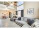 Open concept living room with wood-look tile floors connects the living and dining areas at 17606 N 17Th Pl # 1054, Phoenix, AZ 85022