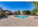 Community pool area with lounge chairs and well-maintained landscaping for relaxation at 17606 N 17Th Pl # 1054, Phoenix, AZ 85022