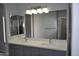 Large modern bathroom with double vanity and large mirror at 17810 W Marshall Ln, Surprise, AZ 85388